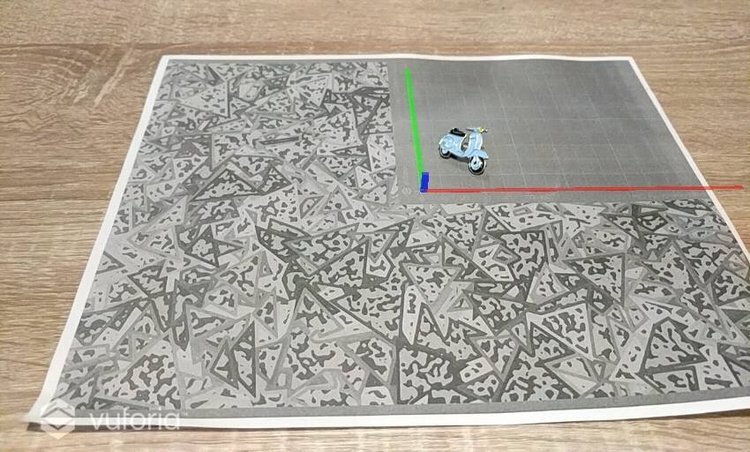 Vuforia image-target test showing a 3D scooter model anchored above a printed tracking pattern